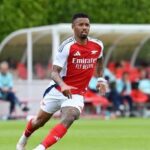 Brazilian striker Gabriel Jesus pictured with headline reporting Atalanta’s €28 million transfer bid amid Arsenal exit rumors.