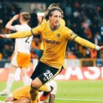 Fábio Silva Dortmund transfer – Portuguese striker celebrating a goal in Wolves jersey with arms wide